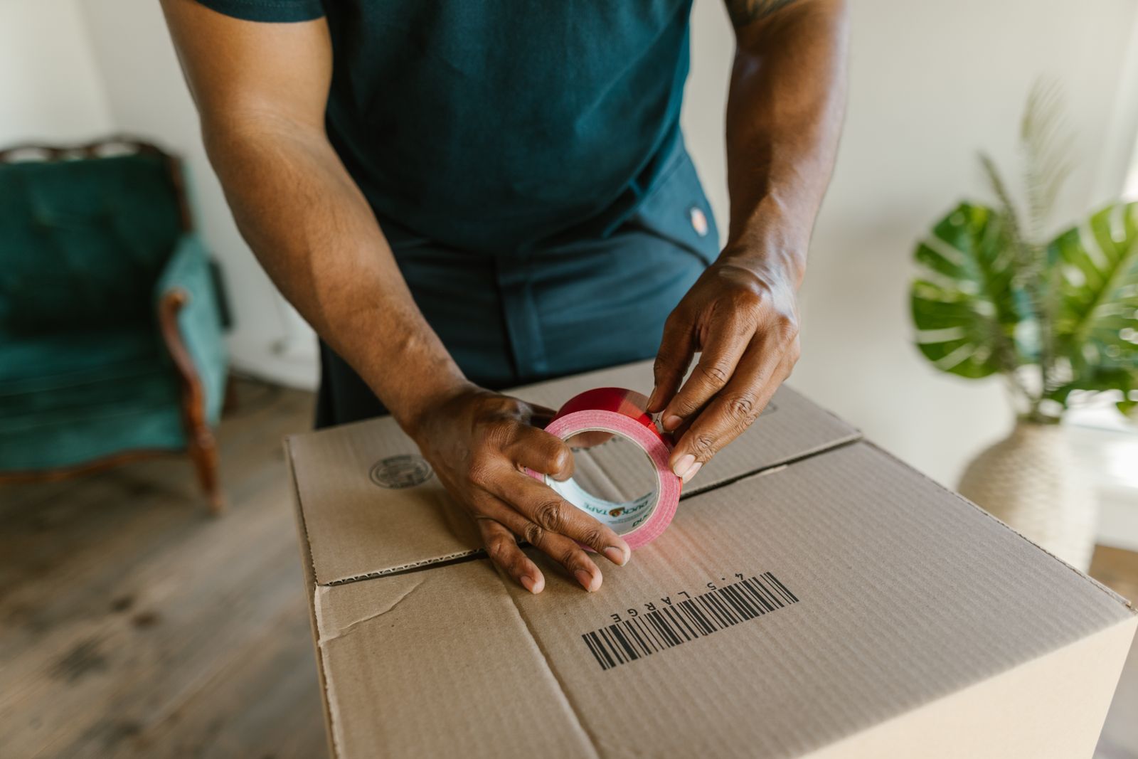 Sealing a moving box with tape